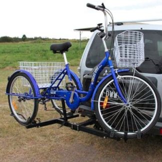 Blue adult tricycle with white basket on car bike rack. Electric and folding tricycles available for seniors and disability mobility.