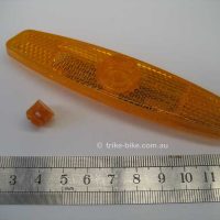 Tricycle Reflector and Indicator Lens Close-up of orange tricycle reflector and indicator lens. Small and large lens for adult tricycle visibility.