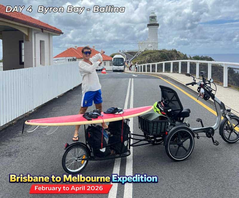 A cargo tricycle with surfboard on top for transport. Perfect for adults and seniors in Australia.