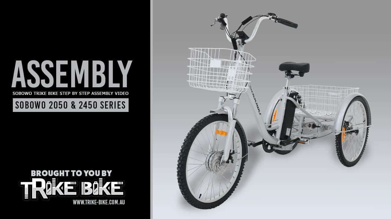 Adult tricycle with silver frame, large front basket and black seat. Ideal for seniors and disability mobility.