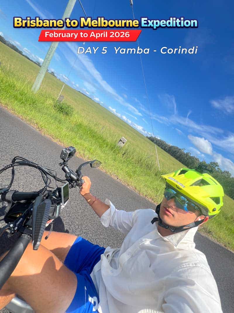 Man wearing a yellow helmet on an adult tricycle