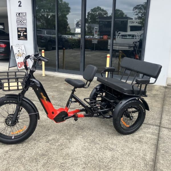 Red and Black Electric Tricycle for Adults An adult electric tricycle in red and black, suitable for seniors and those with mobility needs.