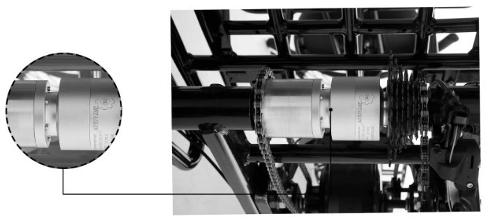 Close-up of a tricycle's axle and bearing, showing detailed mechanics. Essential component for smooth ride.