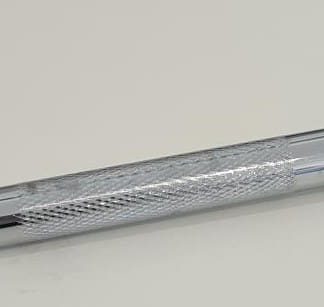 A silver metal kickstand for adult tricycles