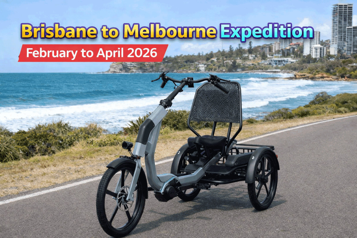 Adult electric tricycle for senior mobility on Australian roads. Grey and black tricycle with basket.